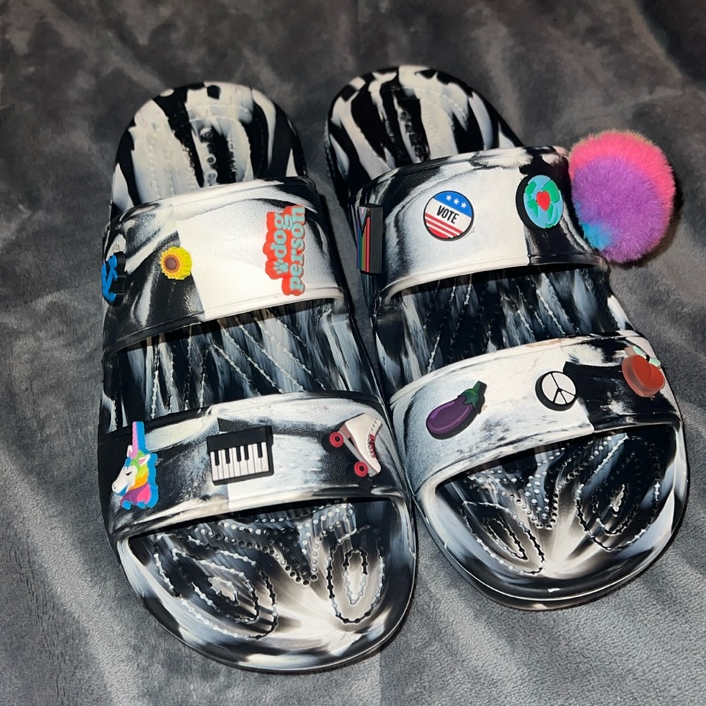 Customized croc sandals with several jibbitz in new condition